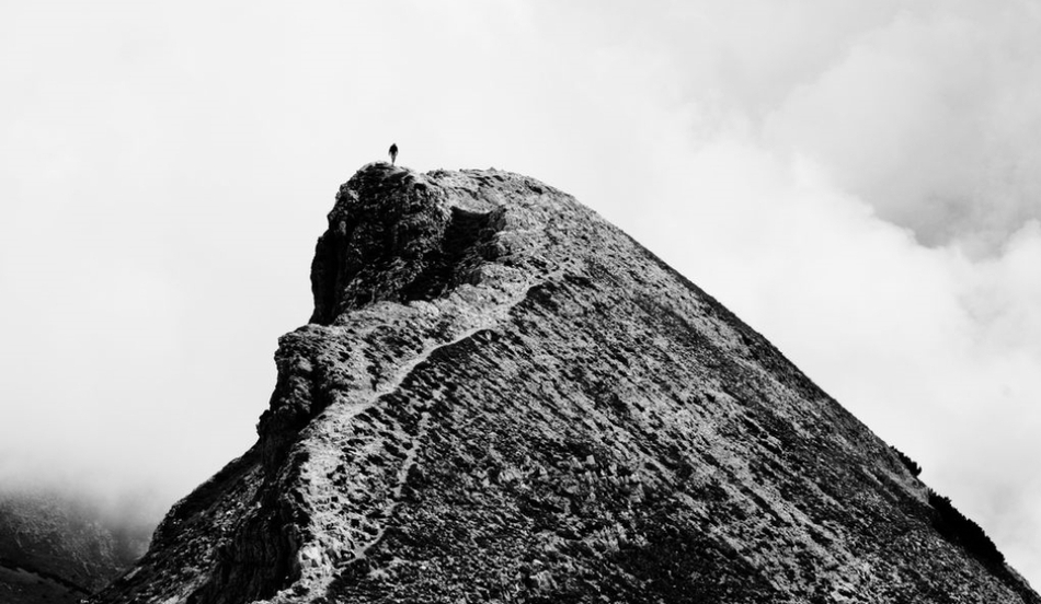 person a top mountain